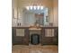 Bathroom vanity featuring dual sinks, granite countertops and a makeup station at 5343 Sagamore Ct, New Port Richey, FL 34655