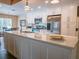Well-lit kitchen with white cabinetry, stainless steel appliances, and spacious island at 5343 Sagamore Ct, New Port Richey, FL 34655