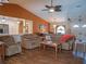 Open-concept living room with hardwood floors, vaulted ceilings, and comfortable seating area at 5343 Sagamore Ct, New Port Richey, FL 34655
