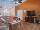 Cozy living room featuring hardwood floors, television, and comfortable seating with access to other rooms at 5343 Sagamore Ct, New Port Richey, FL 34655