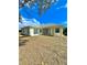 A wide view of the backyard with grass at 5525 Thorngrove Way, Spring Hill, FL 34609