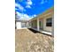 A covered backyard patio that is perfect for outdoor relaxation and enjoyment at 5525 Thorngrove Way, Spring Hill, FL 34609