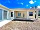 An inviting covered backyard patio, perfect for outdoor relaxation and enjoyment at 5525 Thorngrove Way, Spring Hill, FL 34609