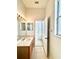 Bathroom featuring a large mirror, vanity, and tile flooring at 5525 Thorngrove Way, Spring Hill, FL 34609