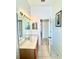 Bathroom featuring a vanity with ample countertop space and a doorway leading to another part of the home at 5525 Thorngrove Way, Spring Hill, FL 34609