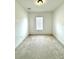 Bright bedroom featuring a window with blinds, providing natural light and privacy at 5525 Thorngrove Way, Spring Hill, FL 34609
