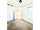 Cozy bedroom with plush carpeting and double doors at 5525 Thorngrove Way, Spring Hill, FL 34609