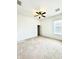 Spacious bedroom with a ceiling fan and a large window offering plenty of natural light at 5525 Thorngrove Way, Spring Hill, FL 34609