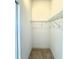 Walk-in closet featuring built-in shelving for optimal organization and storage space at 5525 Thorngrove Way, Spring Hill, FL 34609