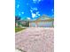 Spacious brick driveway leading to a well-maintained single-story home with a two-car garage at 5525 Thorngrove Way, Spring Hill, FL 34609