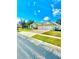 Lovely single-story home featuring a lush lawn, brick driveway, and a convenient two-car garage at 5525 Thorngrove Way, Spring Hill, FL 34609