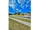 Charming home with a two-car garage and well-manicured lawn and street view at 5525 Thorngrove Way, Spring Hill, FL 34609
