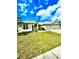 Bright, inviting home with a well-kept lawn and a two-car garage at 5525 Thorngrove Way, Spring Hill, FL 34609