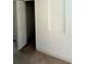 Hallway entrance with carpeted floor and doorway to rooms at 5525 Thorngrove Way, Spring Hill, FL 34609