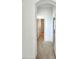Hallway with carpet leading to bathroom with a shower at 5525 Thorngrove Way, Spring Hill, FL 34609
