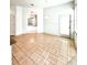 Open concept living room with tiled flooring and natural light at 5525 Thorngrove Way, Spring Hill, FL 34609
