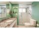 Modern bathroom with a walk-in shower, granite counters, and updated fixtures at 620 Edgewater Dr # 501, Dunedin, FL 34698