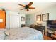 Cozy bedroom with a ceiling fan, ample storage, and a bright, airy feel at 620 Edgewater Dr # 501, Dunedin, FL 34698