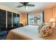 Bright bedroom featuring a ceiling fan and a scenic view from the window at 620 Edgewater Dr # 501, Dunedin, FL 34698