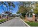 Welcome to Dunedin, a quaint entrance with lush greenery and charming brick signage on Main Street at 620 Edgewater Dr # 501, Dunedin, FL 34698