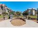 Community grilling area with stainless steel grills for outdoor cooking and entertaining in a beautifully landscaped space at 620 Edgewater Dr # 501, Dunedin, FL 34698