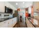 Spacious kitchen with white cabinetry, stainless steel appliances, and an open layout at 620 Edgewater Dr # 501, Dunedin, FL 34698