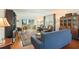 Cozy living room with hardwood floors, a comfortable sofa, and a large rug for a welcoming atmosphere at 620 Edgewater Dr # 501, Dunedin, FL 34698