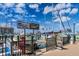 Picturesque marina view with boats docked under a blue sky with fluffy white clouds on the water at 620 Edgewater Dr # 501, Dunedin, FL 34698