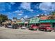 Vibrant retail shops with colorful awnings and ample parking, inviting shoppers to explore downtown at 620 Edgewater Dr # 501, Dunedin, FL 34698