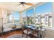 Sun room featuring ample natural light, comfortable seating, and panoramic views of the surrounding cityscape at 620 Edgewater Dr # 501, Dunedin, FL 34698