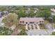 Aerial shot showcasing townhomes with garages, balconies, mature trees, and landscaping at 6343 92Nd N Pl # 2102, Pinellas Park, FL 33782