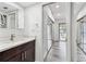An attached bathroom with modern fixtures and a full mirror leading to the Primary bedroom at 6343 92Nd N Pl # 2102, Pinellas Park, FL 33782