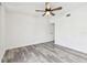 Bedroom boasts gray wood-look flooring and a ceiling fan at 6343 92Nd N Pl # 2102, Pinellas Park, FL 33782
