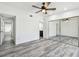 Spacious bedroom featuring gray wood-look floors and closet with mirrored doors at 6343 92Nd N Pl # 2102, Pinellas Park, FL 33782