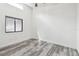 Bright bedroom featuring modern flooring, a window, and a ceiling fan at 6343 92Nd N Pl # 2102, Pinellas Park, FL 33782