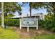 A photograph of the community sign that reads: Lake Forest at 6343 92Nd N Pl # 2102, Pinellas Park, FL 33782