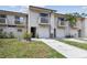 Townhome featuring balconies, a one car garage, a front lawn and neutral siding at 6343 92Nd N Pl # 2102, Pinellas Park, FL 33782