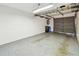 Well-lit garage with overhead storage solutions and durable epoxy flooring at 6343 92Nd N Pl # 2102, Pinellas Park, FL 33782