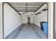 Attached garage featuring epoxy floors and laundry room access at 6343 92Nd N Pl # 2102, Pinellas Park, FL 33782