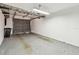 Clean garage featuring organized storage racks and neutral-toned epoxy flooring at 6343 92Nd N Pl # 2102, Pinellas Park, FL 33782