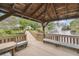 Relaxing waterfront view from the gazebo; the perfect spot for peaceful reflection and enjoying community amenities at 6343 92Nd N Pl # 2102, Pinellas Park, FL 33782