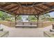 Community gazebo offers peaceful seating with a beautiful water fountain view and lush surroundings at 6343 92Nd N Pl # 2102, Pinellas Park, FL 33782