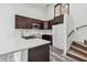 Charming kitchen with quartz counters, stainless sink, dark cabinets and a stylish subway tile backsplash at 6343 92Nd N Pl # 2102, Pinellas Park, FL 33782