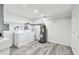 Finished laundry room with water heater, and access to garage and basement area at 6343 92Nd N Pl # 2102, Pinellas Park, FL 33782