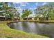 Lush pond with a view from the property creates a refreshing and picturesque backdrop for outdoor activities at 6343 92Nd N Pl # 2102, Pinellas Park, FL 33782