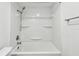 Bright shower over tub with a shower head and shelf at 6343 92Nd N Pl # 2102, Pinellas Park, FL 33782