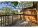 Water view from a wooden patio with a wooden fence and trees overhead at 6343 92Nd N Pl # 2102, Pinellas Park, FL 33782