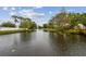 Picturesque water view showcasing the tranquil surroundings and landscaping of the community at 6343 92Nd N Pl # 2102, Pinellas Park, FL 33782