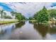 Picturesque water view showcasing the tranquil surroundings and landscaping of the community at 6343 92Nd N Pl # 2102, Pinellas Park, FL 33782