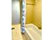 Bathroom shower with colorful shower curtain and tile surround at 717 Cordova Green, Seminole, FL 33777